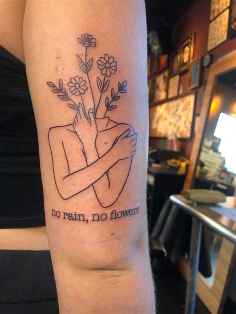 No rain no flowers tattoo thigh